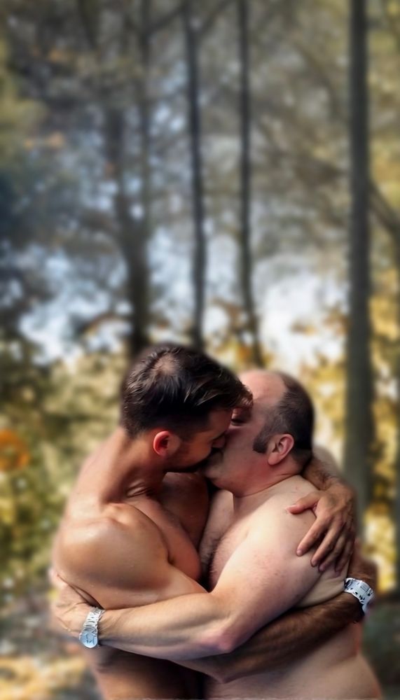 Two shirtless men kissing, very gay, men kissing in the forest 