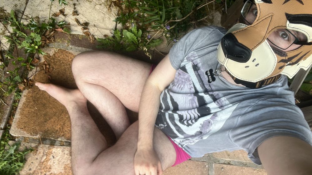 selfie of me in a pup hood, sat in a puddle