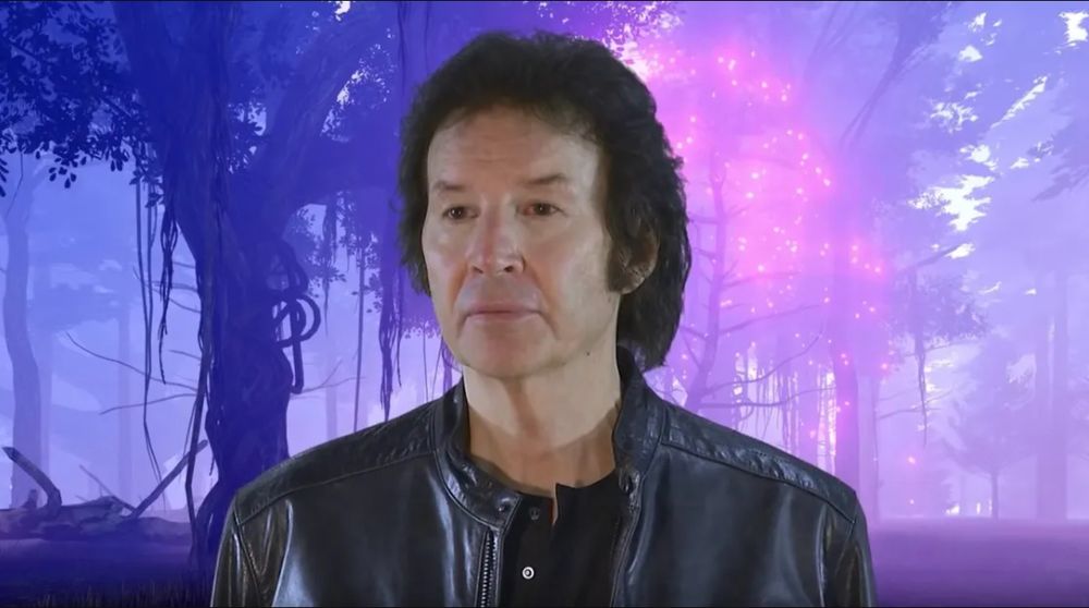 Award-winning film director/writer/actor/architect Neil Breen wears an extremely flattering leather jacket in an ethereal forest glade