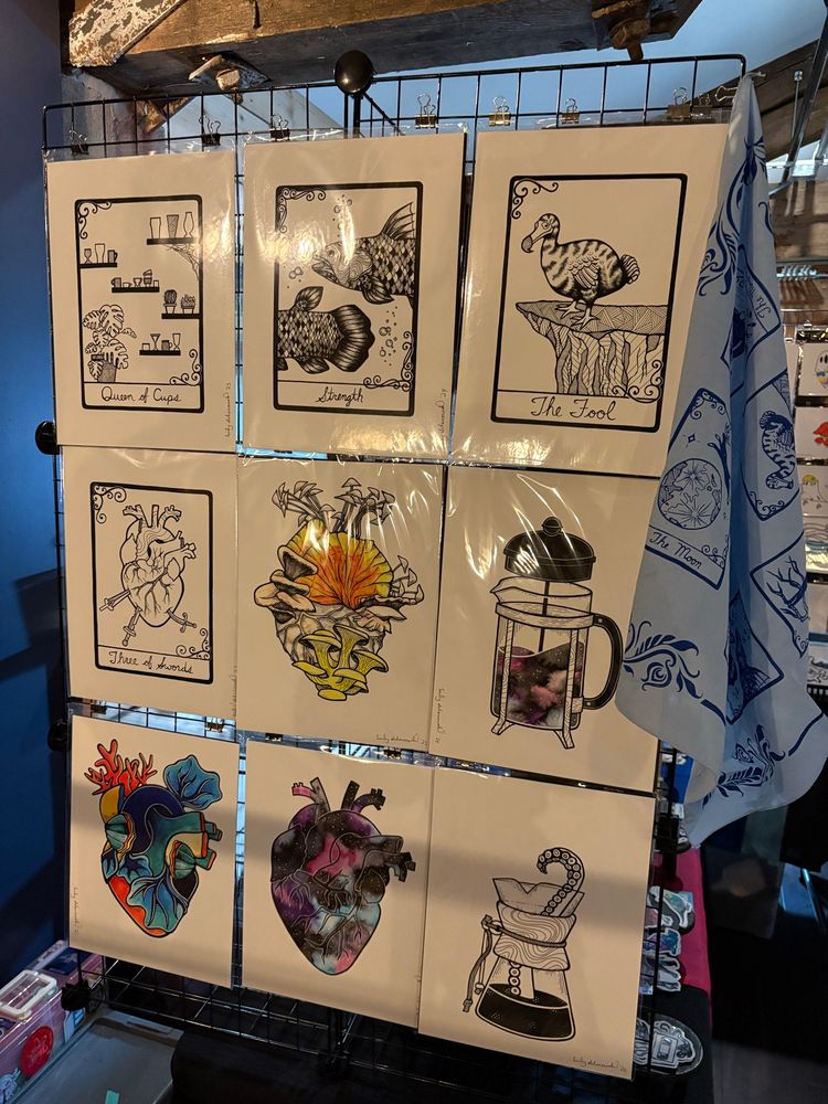 Art prints including tarot cards, anatomical hearts, and spooky coffee