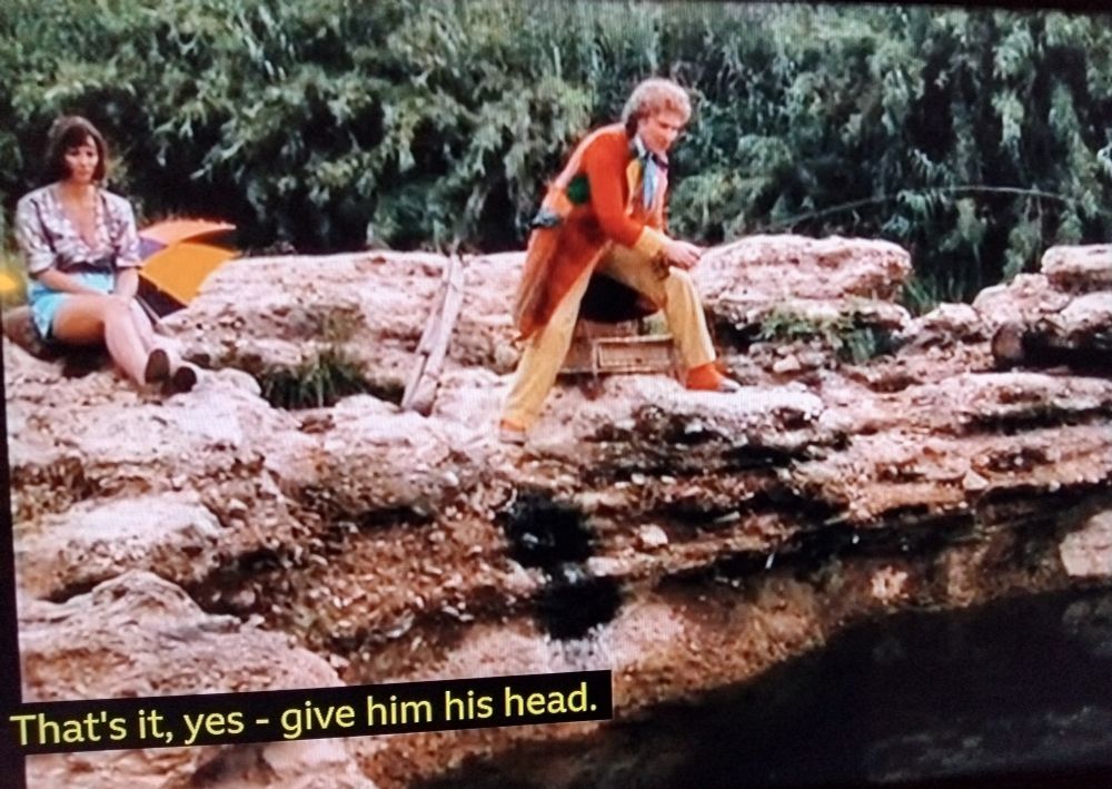Screen grab from 'The Two Doctors'. The Sixth Doctor is saying: "That's it, yes - give him his head."