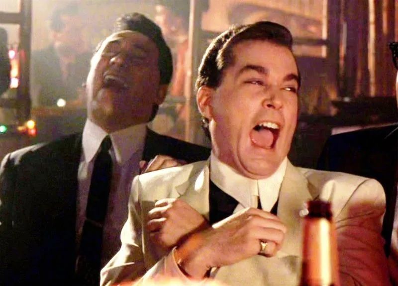 Scene of Ray Liotta laughing wildly from the movie GOODFELLAS 