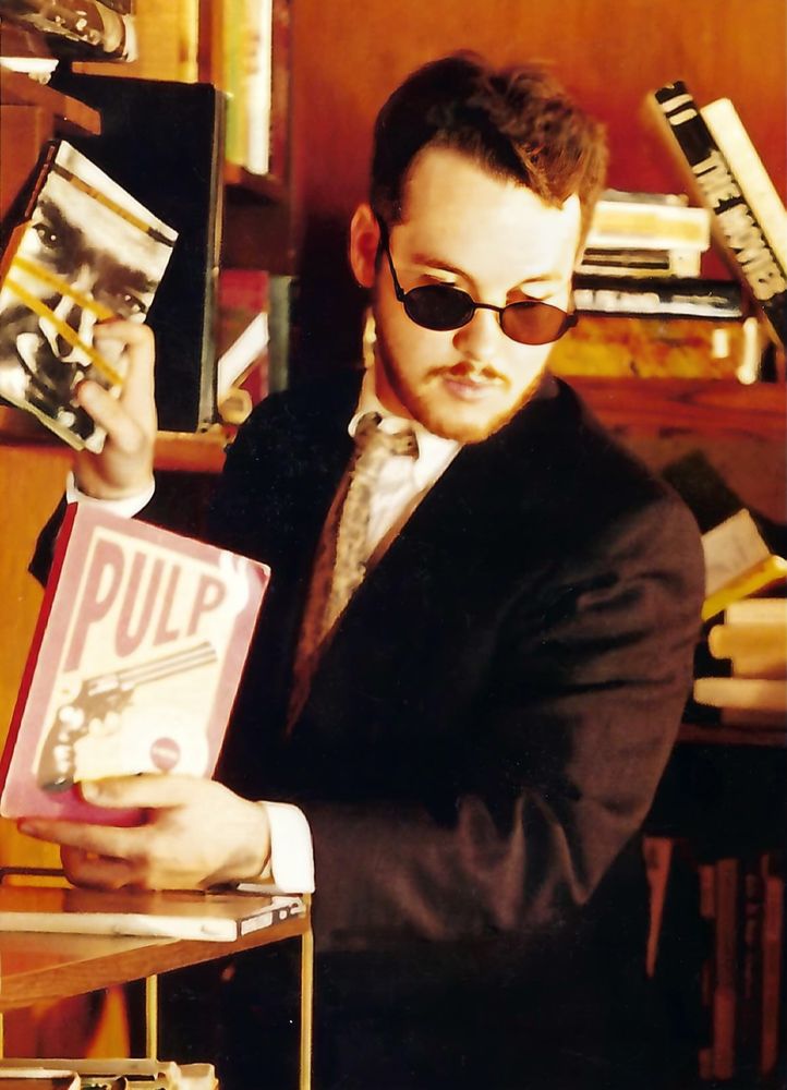 A promo photo of me for a play I was in way back in 1997.  For reasons that I'm sure made sense to the playwright/director, my character needed to be full Barney Stinson SUITED UP, in a theater space in Texas in June with terrible air conditioning.  

I did look pretty cool, though.