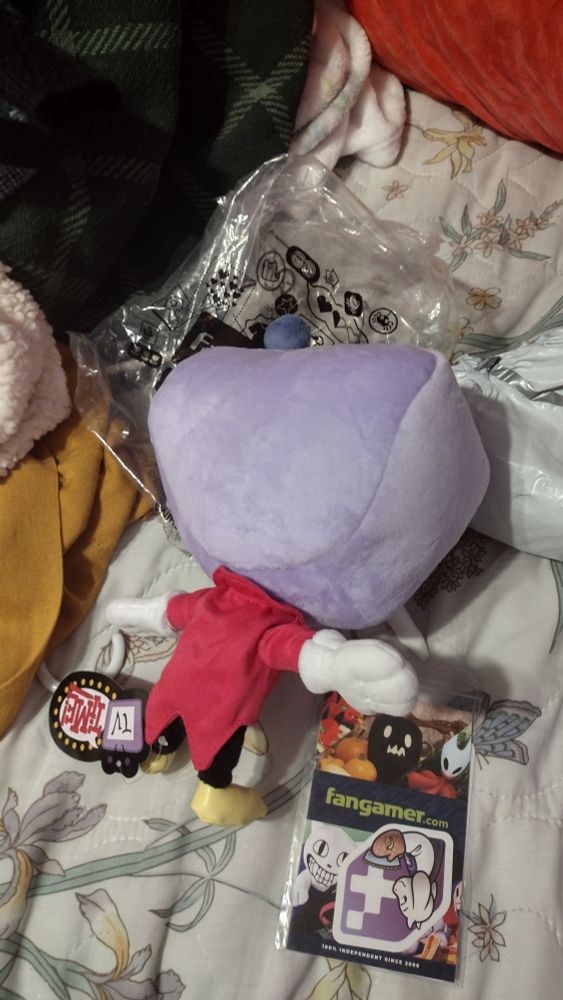 Tenna plush thrown face down on the bed