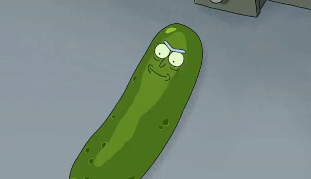 pickle rick from rick and morty laying on the floor