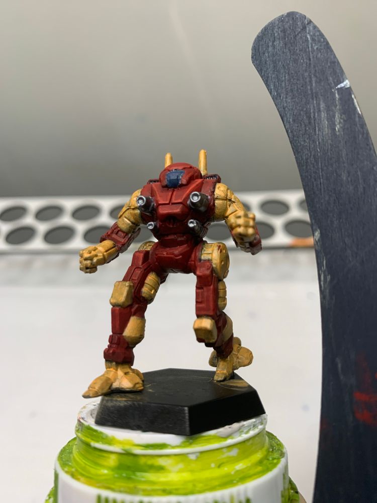 an ostol from battletech painted red and orange