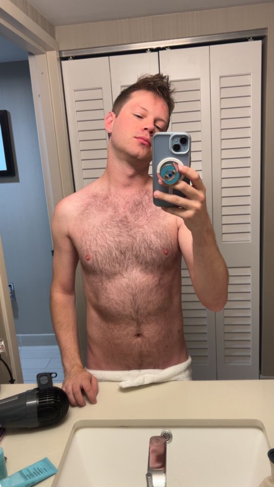 Shirtless selfie twink with furry chest looking morning skinny