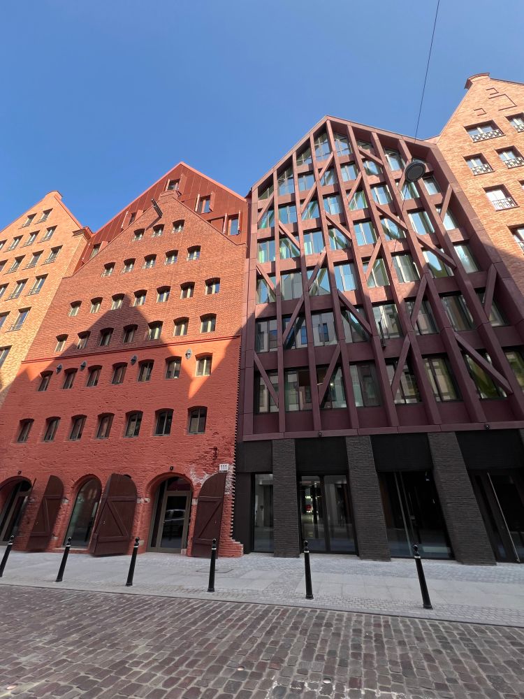 Row buildings with front-facing gables with modern details. 