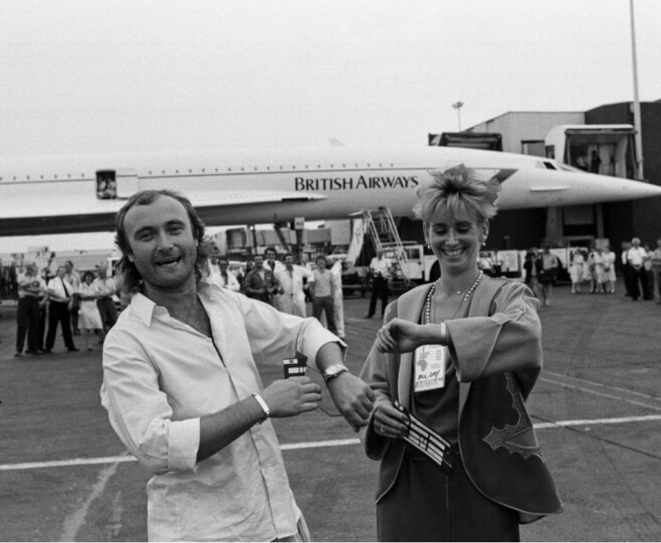 Phil Collins stood next to Concorde preparing to fly from London to Philadelphia to play at both LiveAid concerts on the same day in 1985