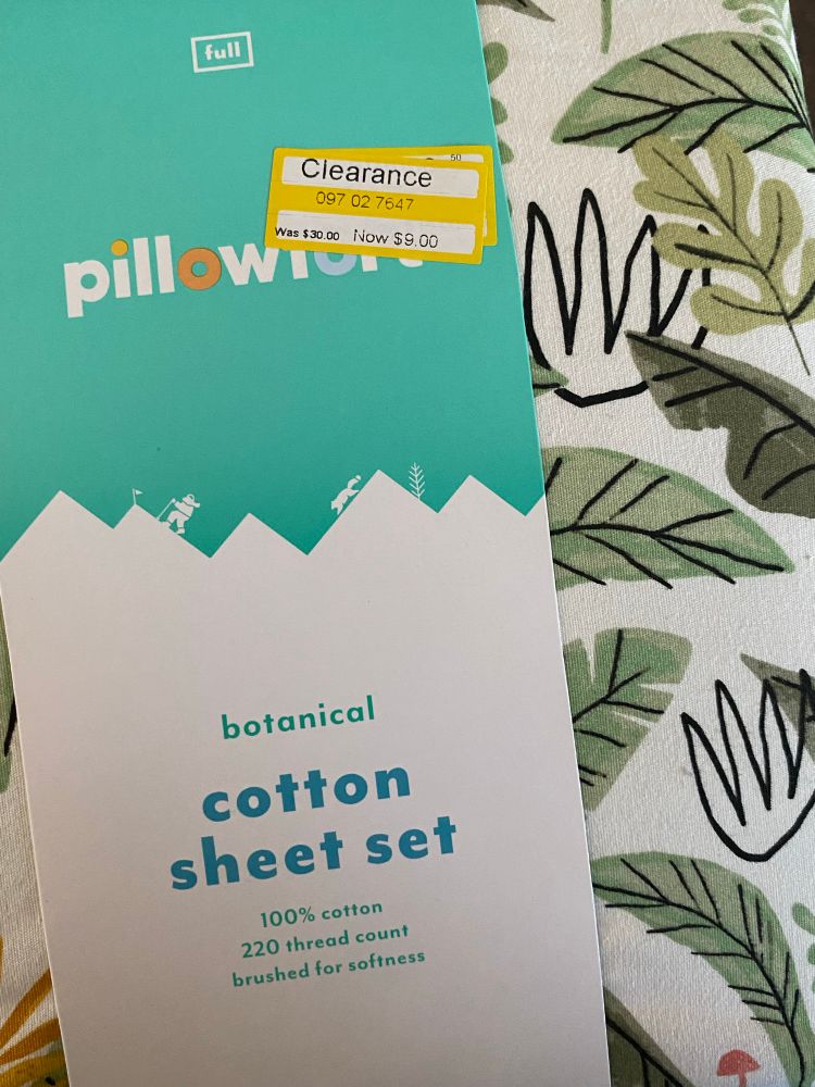 Picture of a bedsheet set with a clearance sticker
