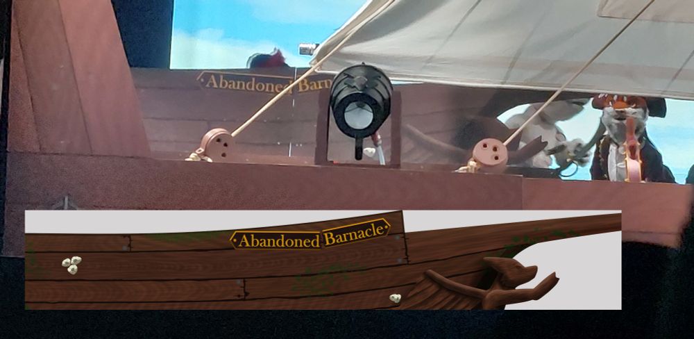 picture from the eurofurence pawpetshow 2025; with a detailled view of a pirate ship in the background