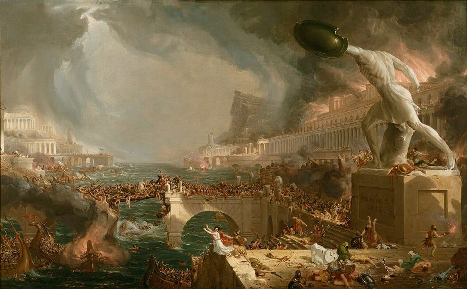 A dramatic painting of chaos and destruction in a classical city, with smoke and fire engulfing grand marble buildings and columns along the shoreline. A massive storm churns the dark sky while raging seas crash into a stone bridge crowded with battling figures, many falling into the water as ships burn and sink around them. On the right, a colossal statue of a warrior holding a round shield looms over the scene, towering above the turmoil as if mocking the collapse below. The foreground is filled with fleeing and dying figures, some reaching out in desperation, while the background shows palatial structures consumed by fire and dark smoke. The image conveys a sense of apocalyptic ruin and the violent downfall of a once-great civilization