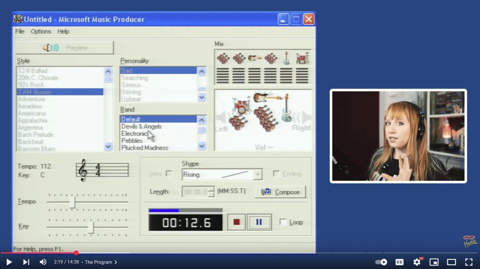 A screenshot of a YouTube video at timestamp 2:19 shows an old Windows-95-style program called “Microsoft Music Producer” open on the desktop. The interface has dropdown menus for “Style,” “Personality,” and “Band,” with options like “50’s Rock,” “Sad,” “Serious,” and “Electronic,” as well as a panel displaying a cartoon drum kit, guitar, and bass in the “Mix” section. Below are controls for tempo, key, song length, and playback with a digital timer reading 00:12.6, along with play, pause, and record buttons. On the right side of the screen, there’s a smaller inset video of a woman with long reddish-blonde hair wearing headphones, speaking animatedly to the camera against a background of bookshelves and recording equipment. The overall scene contrasts retro music software with modern commentary