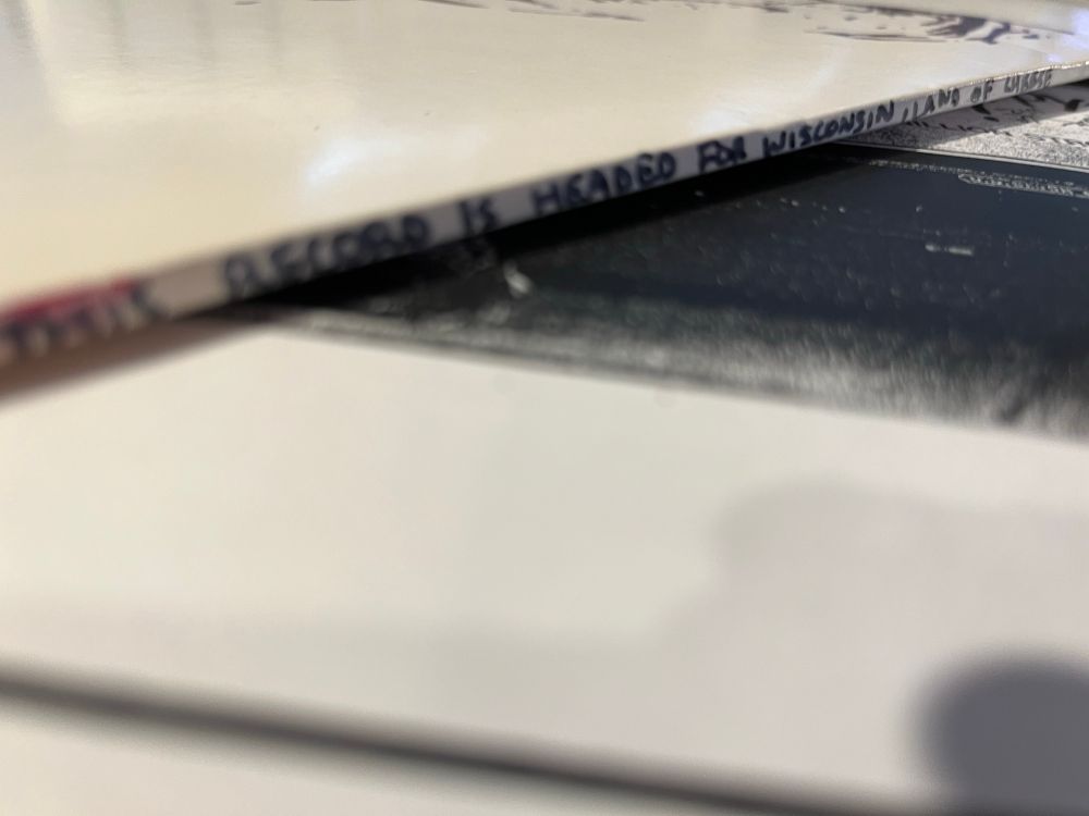 writing on the spine: "This record is headed for Wisconsin, land of cheese"