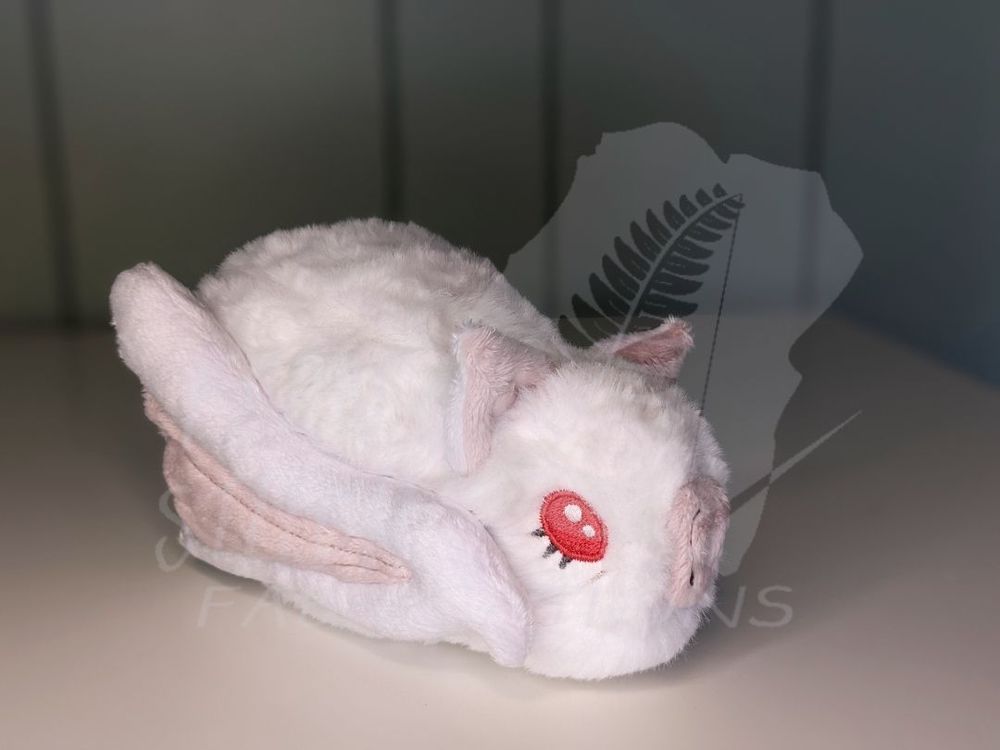 A plush of a fluffy, white bat with piercing red eyes, thick eyelashes, and a pink nose. Surely too cute to be a vampire lord.