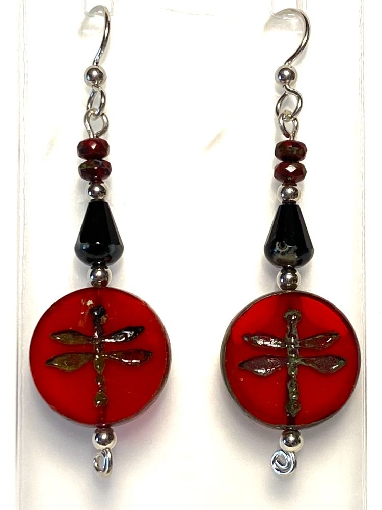 These sterling silver earrings with stacked Czech glass beads are all about the big coin beads at the bottom, the orange-red ones with dragonflies stamped into them. A picasso finish helped emphasize the images and edges. Above those, black faceted teardrop beads also had some picasso finish at the ends. And way up at the top, two tiny faceted brick red rondelles had picasso finish as well. All the metal here is sterling silver.