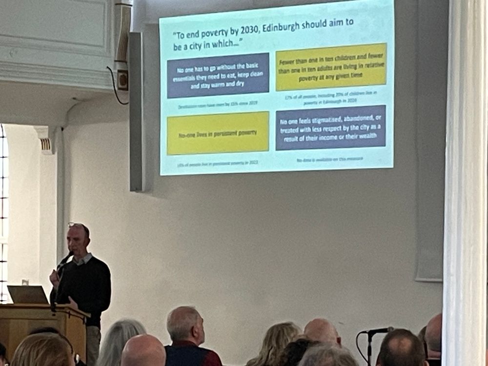 Photo showing speaker and presentation slide at Edinburgh Poverty Commission event. 
