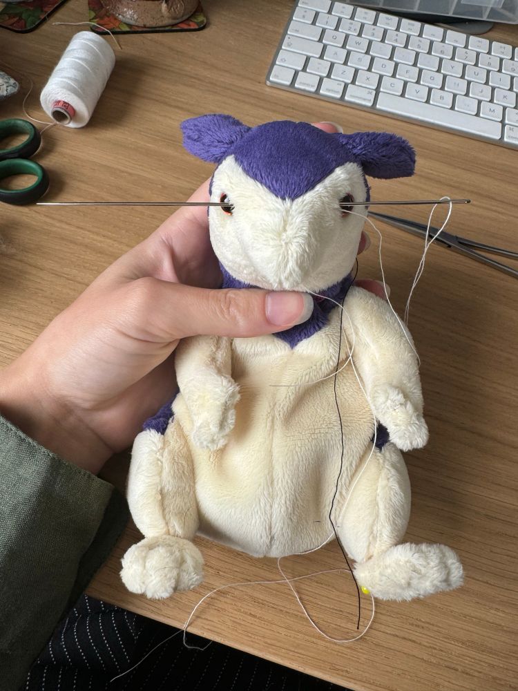 Work in progress hisuian typhlosion. It has a long needle through the face for thread sculpting. The body is still unstuffed. 