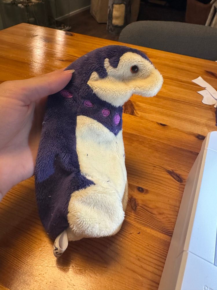 Work in progress hisuian typhlosion plushie. It is turned but has no arms or feet yet, nor stuffing. It looks mildly worried about it. 