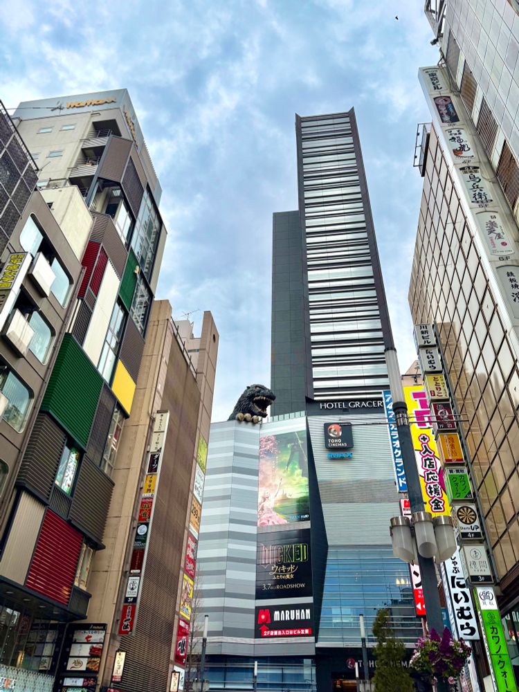Godzilla statue and tall buildings in Shinjuku, Tokyo.