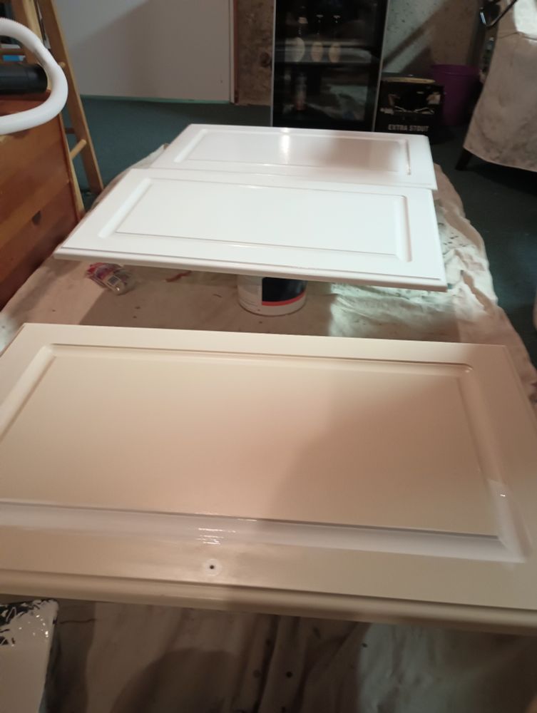 Cabinet door 
Two painted white
One still yellow in process