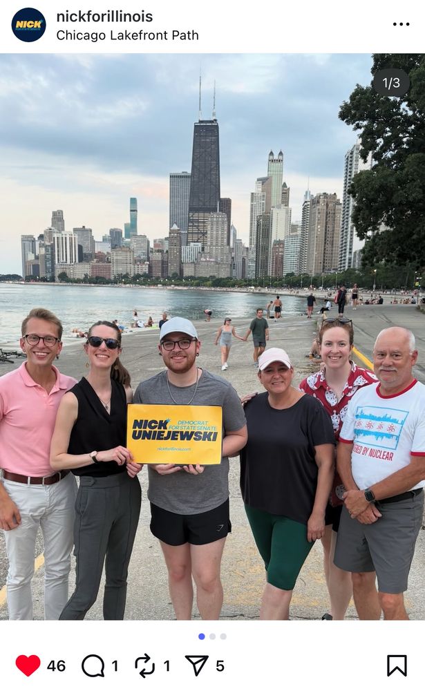 A group of supporters of Nick Uniejewski on the lakefront with the Hancock tower in the background