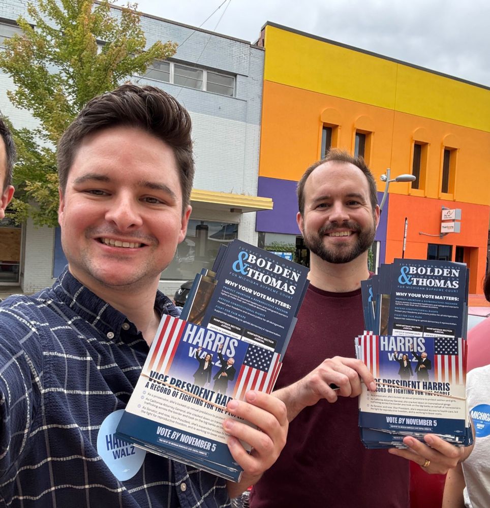 me and james holding literature for democrats, in Battle Creek Michigan
