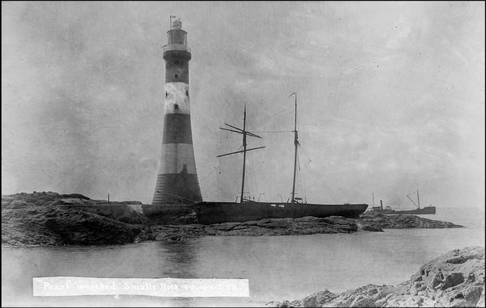 Wreck on The Smalls, 1913, with Rouse family salvage vessel W.S. Caine standing by.