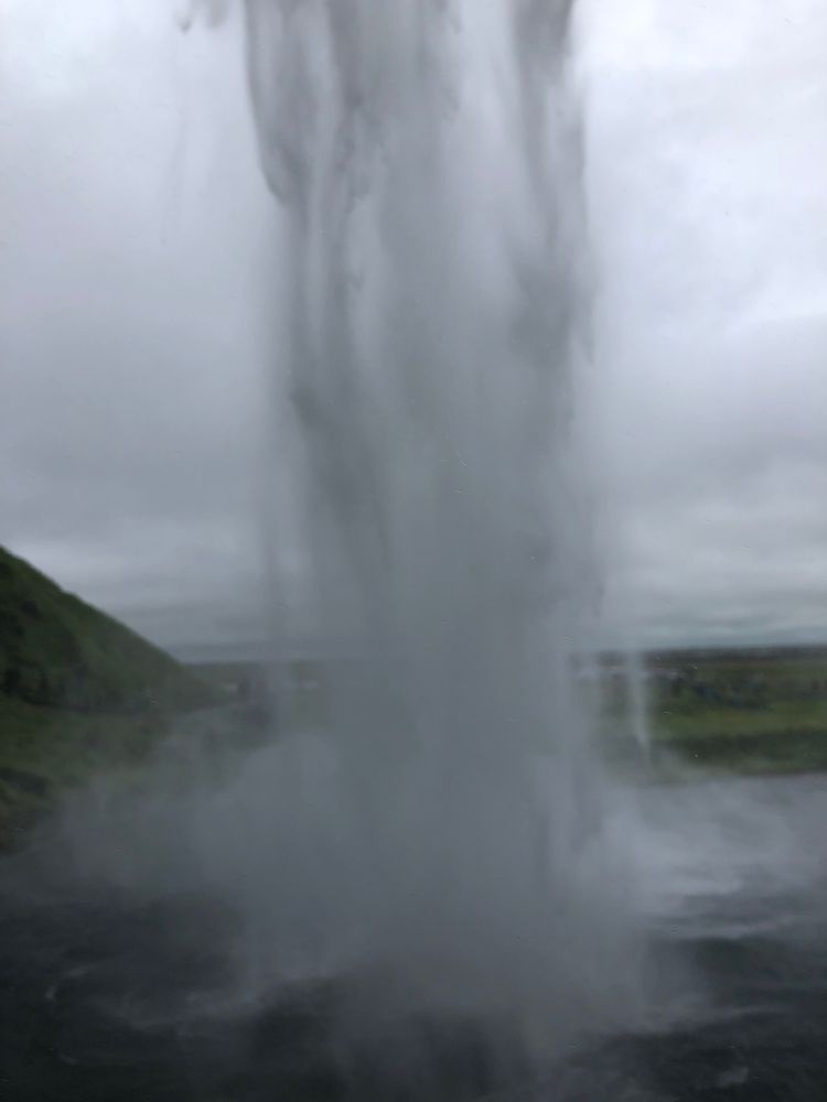 Photo standing behind the waterfall inSeljalandsfoss, Iceland. 