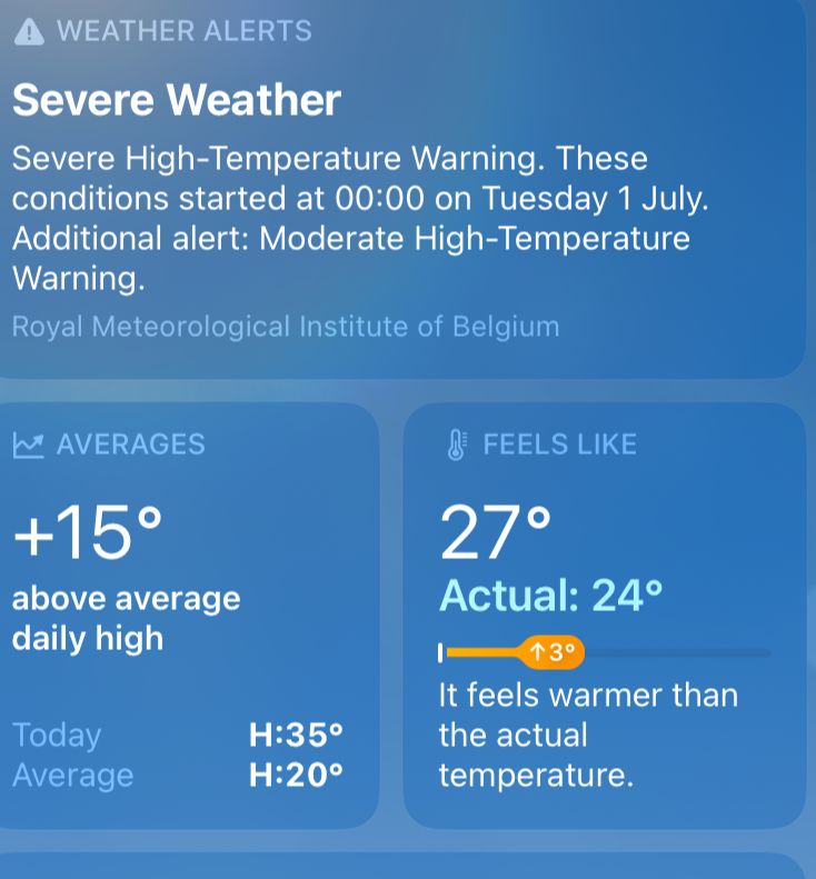 phone weather forecast showing a warning for extreme weather and temperatures 15 degrees above average in Brussels, Belgium