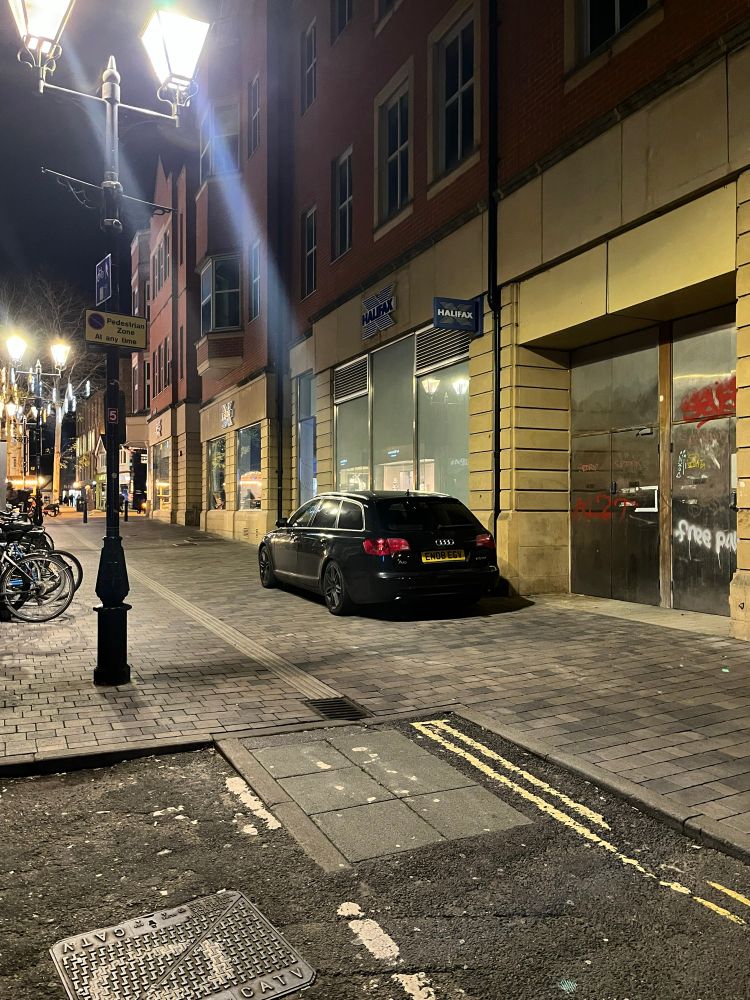 A car parked on the pedestrian section of St Ebbes St
