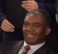 Gif of a scene from the show How I Met Your Mother where a skyscraper design is revealed and a man looks up and down the height of it and says "that's a penis" 