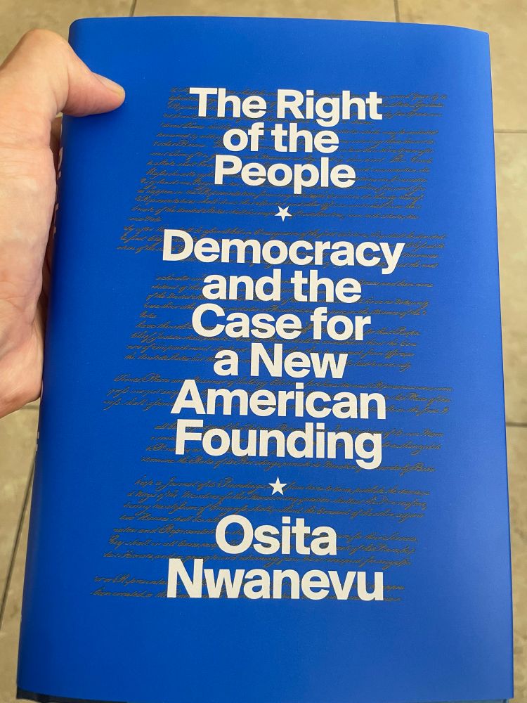 A blue hardcover book titles The Right of the People Democracy and the Case for a New American Founding by Osita Nwanevu