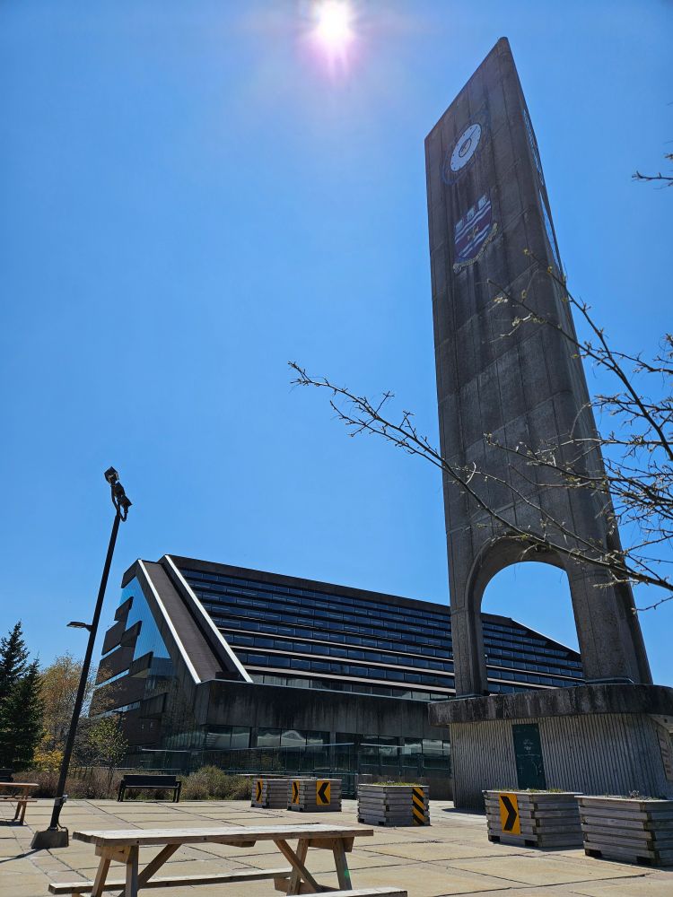 Blue skies and sunshine.  Clock tower and qeii library.