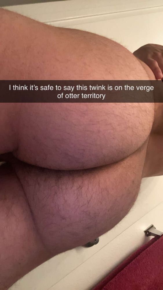 A close-up ass shot showing off the growing body hair on an otherwise smooth adult. A snapchat caption reads “I think it’s safe to say this twink is on the verge of otter territory”