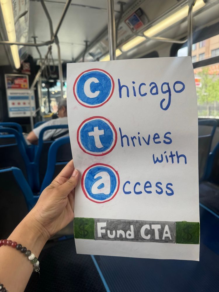 A sign using CTA acronym to say, “Chicago, Thrives with, Access” and Fund CTA written bottom of sign