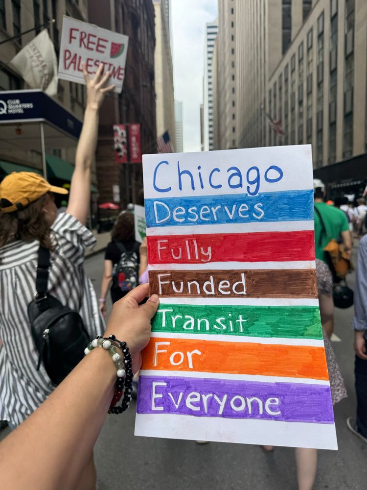A sign that says “Chicago deserves fully funded transit for everyone”