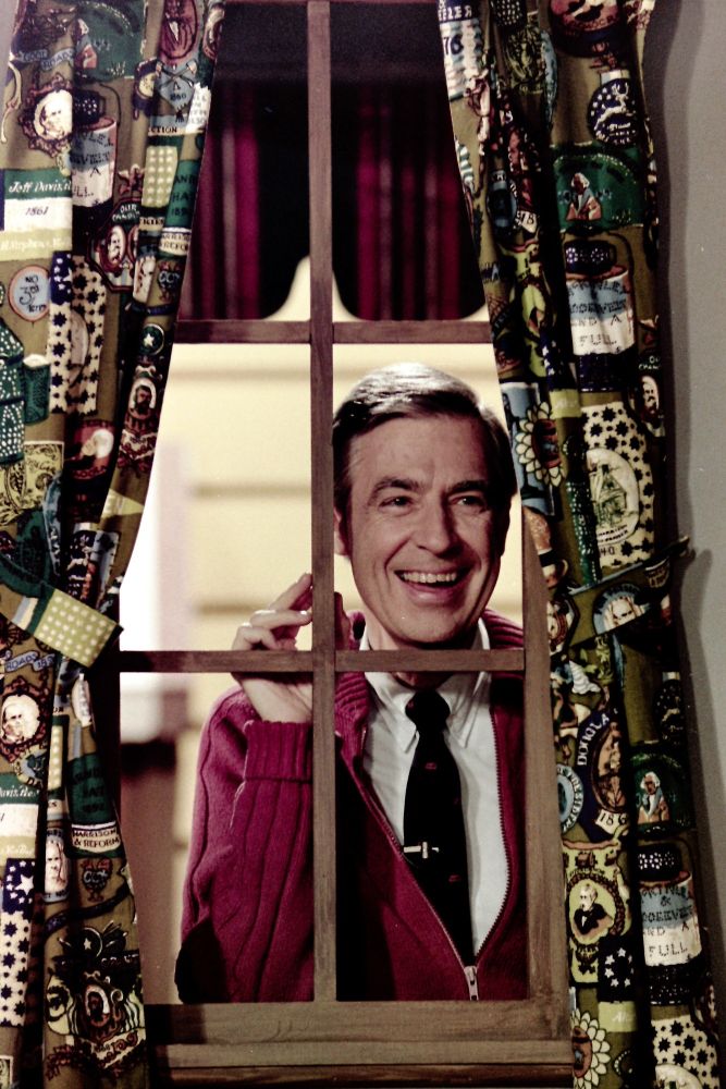 That photo of Mr Rogers looking through the window making the same shape as the Sickos yes cartoon