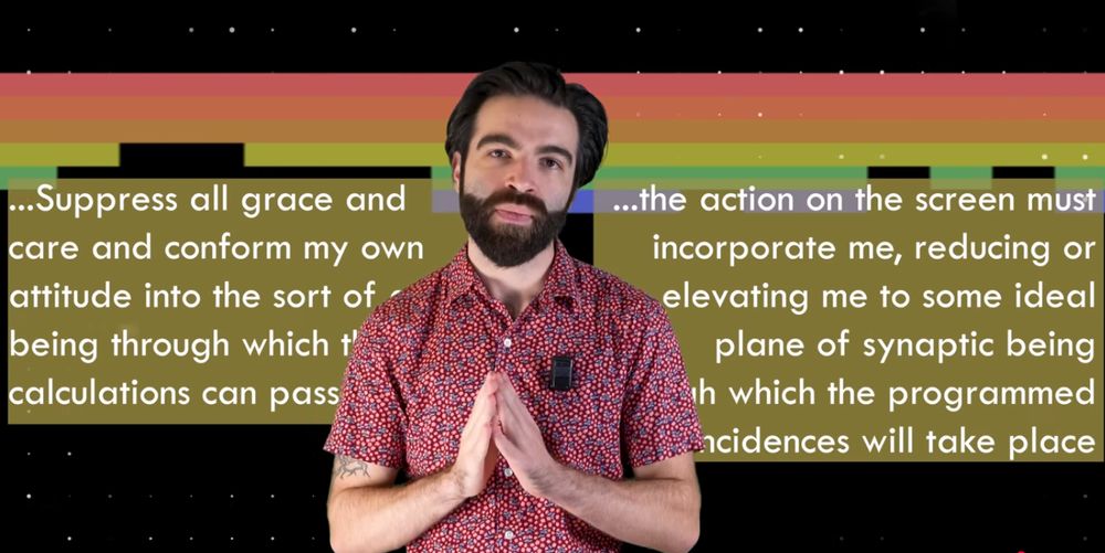 Jacob Geller with his hands folded in front of him; behind him are boxes of text reading "...Suppress all grace and care and conform my own attitude into the sort of being through which the calculations can pass..." and "...the aciton on the screen must incorporate me, reducing or elevating me to some ideal plane of synaptic being through which the programmed coincidences will take place" and behind those boxes is a game of Breakout being played