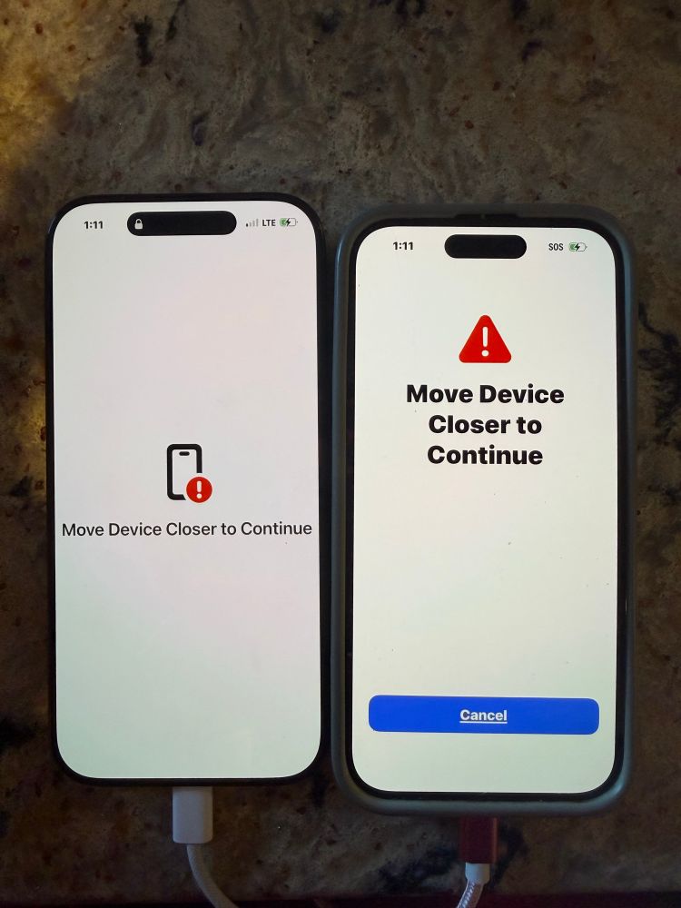 2 iPhones sit next to each other they both read “move device closer to continue” 
