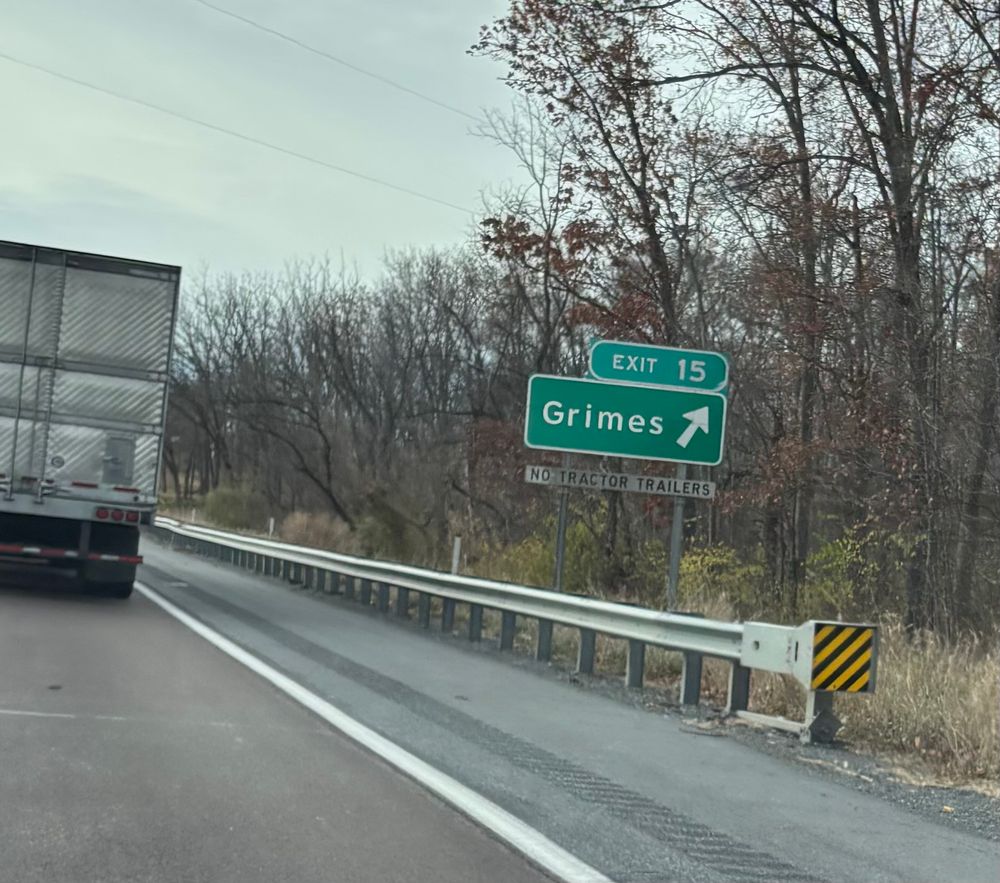 Highway offramp sign that says GRIMES