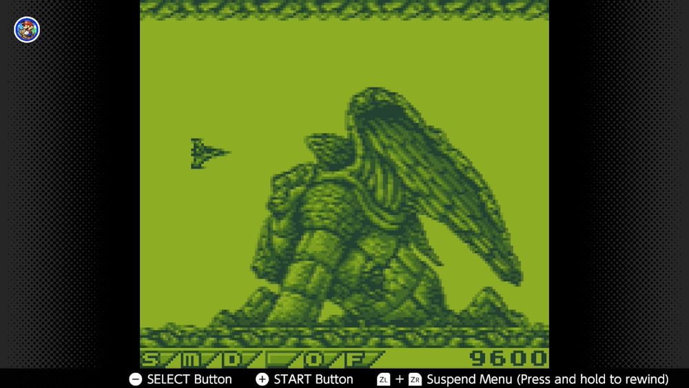An image from Gradius: The Interstellar Assault showing a ship approaching a giant statue of a winged creature.