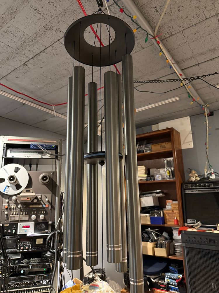 A large set of wind chimes hung in my Dungeon studio with lets of cool music recording gear behind it. 