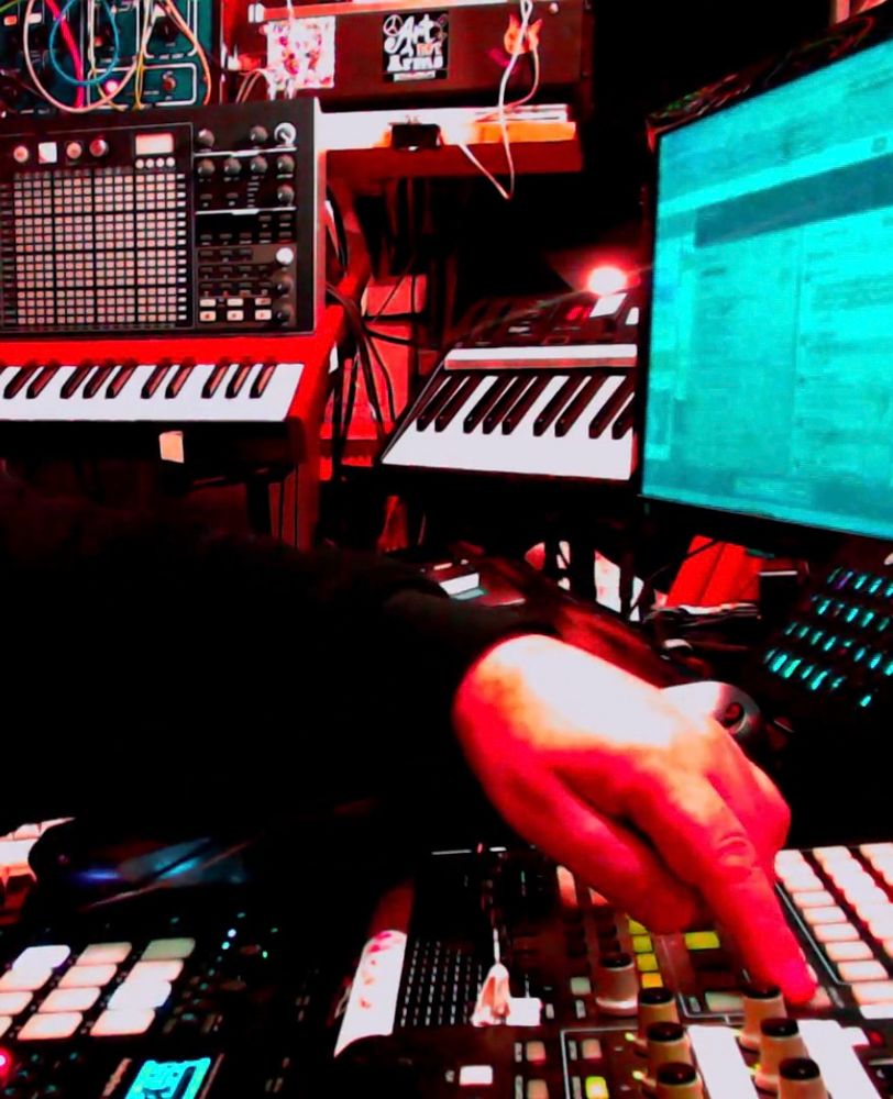 My arm extended to a controller as I press a button to activate scowl-mode…