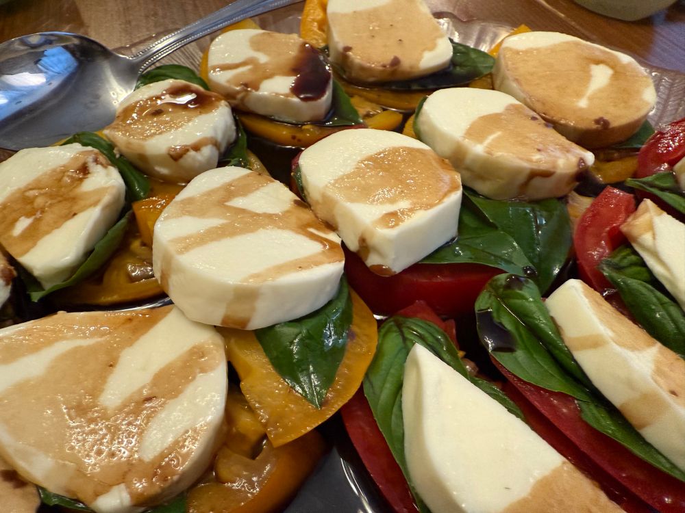 Fresh mozzarella, basil and sliced tomatoes from the garden, with balsamic vinegar 