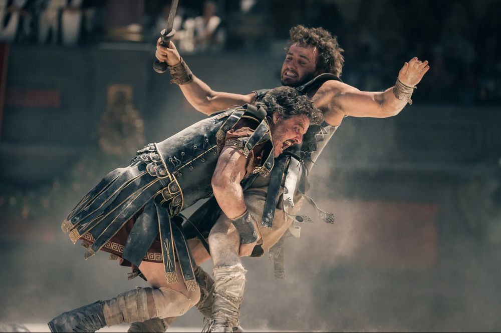 Pedro Pascal plays General Acacius and Paul Mescal plays Lucius in Gladiator II. In this photo from Paramount Pictures Acacius has charged Lucius in the arena and appears to tackle him as part of their encounter.