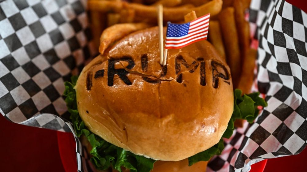 The Texas restaurateur, known for hamburgers with "TRUMP" stamped across the bun, said allegations from the Department of Homeland Security are "not true."