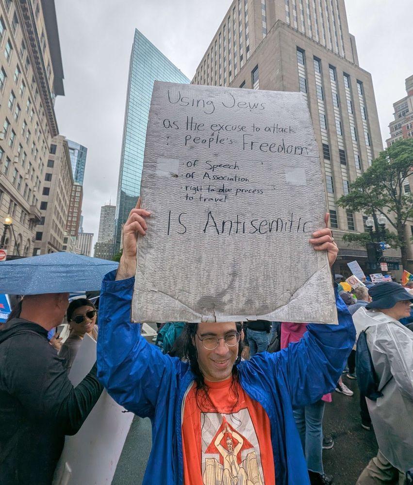 Protest sign: "Using Jews as the excuse to attack people's Freedom (of speech / of association / right to due process / to travel ) is Antisemitism"