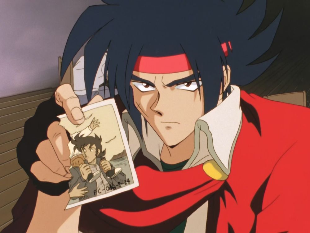 image of Domon Kasshu from Mobile Fighter G Gundam holding a torn photo of his older brother Kyoji