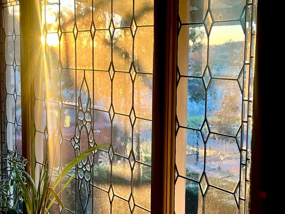 A cut glass window with morning light